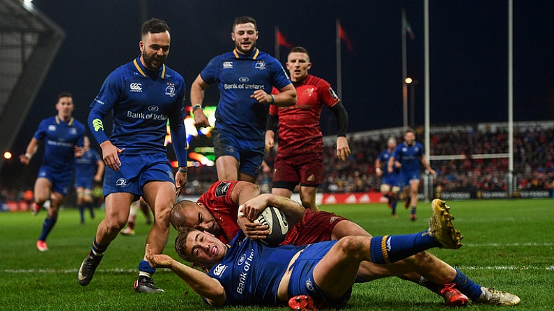 26 December 2017; Jordan Larmour of Leinster scores his side's fourth try despite the tackle of Simon Zebo of Munster during the Guinness PRO14 Round 11 match between Munster and Leinster at Thomond Park in Limerick. Photo by Ramsey Cardy/Sportsfile