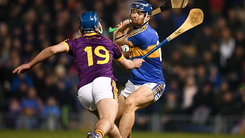 17 February 2018; Jason Forde of Tipperary shoots to score his side's second goal despite the attention of Conor Firman of Wexford during the Allianz Hurling League Division 1A Round 3 match between Tipperary and Wexford at Semple Stadium in Thurles, Tipperary. Photo by Stephen McCarthy/Sportsfile