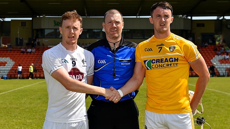 30 June 2018; Captains Brian Byrne of Kildare and Conor McKinley of Antrim with referee David Hughes during the coin toss prior to the Joe McDonagh Cup Relegation / Promotion play-off match between Antrim and Kildare at the Athletic Ground in Armagh. Photo by Seb Daly/Sportsfile