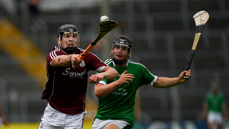 8 July 2018; Oisin Flannery of Galway in action against Padraig Harnett of Limerick during the Electric Ireland GAA Hurling All-Ireland Minor Championship Quarter-Final match between Galway and Limerick at Semple Stadium in Thurles, Co Tipperary. Photo by Ray McManus/Sportsfile