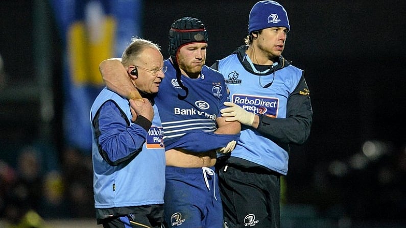 28 December 2013; Leinster's Sean O'Brien is helped from the pitch by Dr. Arthur Tanner, team doctor, left, and Karl Denvir, team physiotherapist, right, after picking up an injury in the second half. Celtic League 2013/14, Round 11. Leinster v Ulster, RDS, Ballsbridge, Dublin. Picture credit: Stephen McCarthy / SPORTSFILE