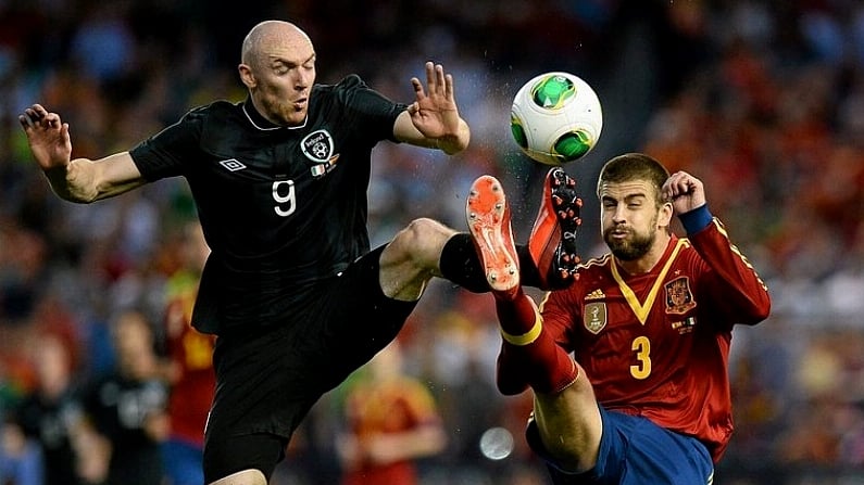 11 June 2013; Conor Sammon, Republic of Ireland, in action against Gerard Pique, Spain. International Friendly, Republic of Ireland v Spain, Yankee Stadium, Bronx, New York, USA. Picture credit: David Maher / SPORTSFILE