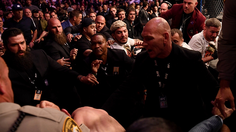 6 October 2018; Khabib Nurmagomedov leaves the octagon in an altercation with members of Conor McGregor's team, including Dillon Danis and John Kavanagh following defeat to  in their UFC lightweight championship fight during UFC 229 at T-Mobile Arena in Las Vegas, Nevada, USA. Photo by Stephen McCarthy/Sportsfile