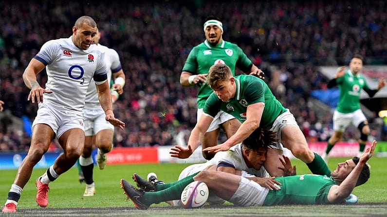 17 March 2018; Garry Ringrose of Ireland dives over to score his side's first try despite the tackle of Anthony Watson of England during the NatWest Six Nations Rugby Championship match between England and Ireland at Twickenham Stadium in London, England. Photo by Ramsey Cardy/Sportsfile