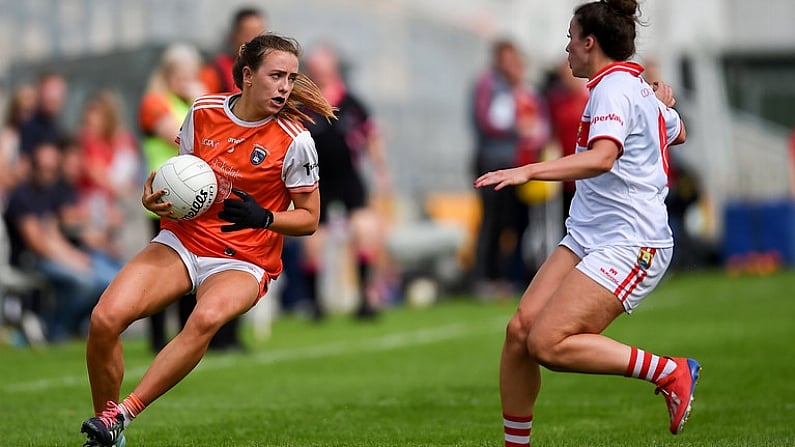 27 July 2019; Tiarna Grimes of Armagh in action against Shauna Kelly of Cork during the TG4 All-Ireland Ladies Football Senior Championship Group 1 Round 3 match between Armagh and Cork at Bord Na Mona O'Connor Park in Tullamore, Offaly. Photo by Ben McShane/Sportsfile