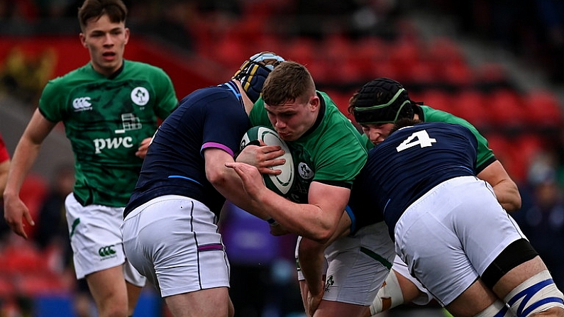 20 March 2022; Jack Boyle of Ireland is tackled by Mikey Jones and Josh Taylor of Scotland during the U20 Six Nations Rugby Championship match between Ireland and Scotland at Musgrave Park in Cork. Photo by Brendan Moran/Sportsfile