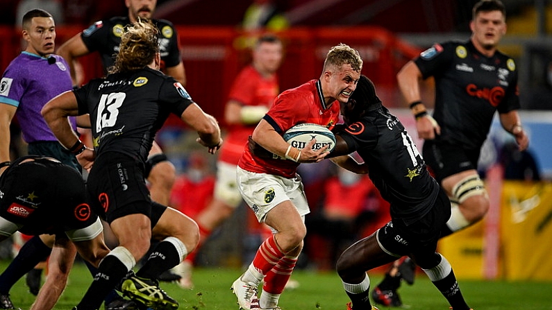 25 September 2021; Craig Casey of Munster in action against Yaw Penxe, right, and Werner Kok of Cell C Sharks during the United Rugby Championship match between Munster and Cell C Sharks at Thomond Park in Limerick. Photo by Piaras O Midheach/Sportsfile