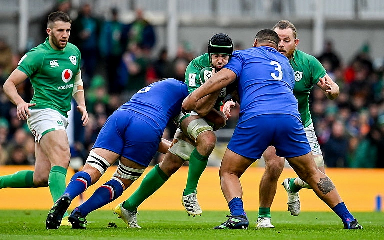 Frances Uini Antonio tackles Caelan Dorris in Ireland v Wales in the Six Nations