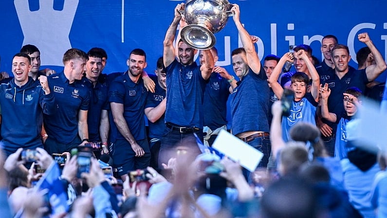 31 July 2023; Captain James McCarthy, left, and manager Dessie Farrell lift the Sam Maguire cup during the homecoming celebrations of the Dublin All-Ireland Football Champions at Smithfield Square in Dublin. Photo by Ramsey Cardy/Sportsfile