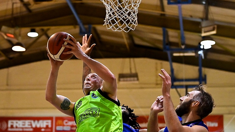 8 January 2022; Kieran Donaghy of Garvey's Tralee Warriors in action against Mark Reynolds of DBS Eanna during the InsureMyHouse.ie Pat Duffy National Cup semi-final match between DBS Eanna and Garveys Warriors Tralee at Neptune Stadium in Cork. Photo by Brendan Moran/Sportsfile