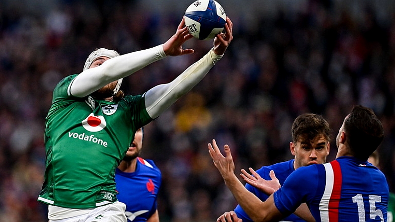 12 February 2022; Mack Hansen of Ireland catches the ball at the restart, ahead of France's Melvyn Jaminet, before going on to score his side's first try, during the Guinness Six Nations Rugby Championship match between France and Ireland at Stade de France in Paris, France. Photo by Seb Daly/Sportsfile