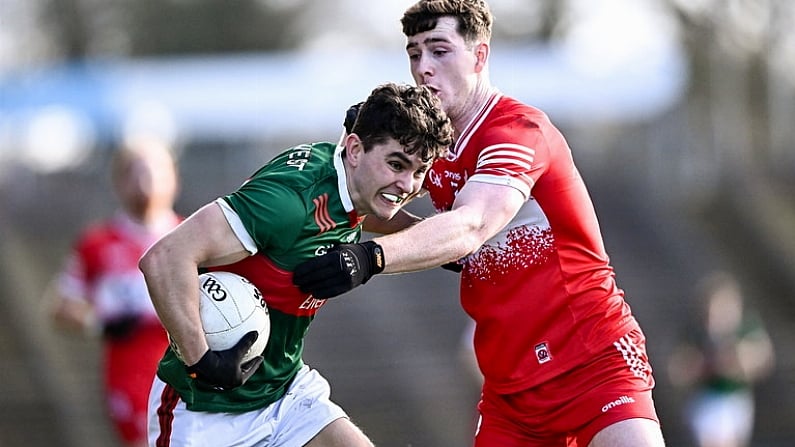 17 March 2024; Tommy Conroy of Mayo in action against Padraig McGrogan of Derry during the Allianz Football League Division 1 match between Mayo and Derry at Hastings Insurance MacHale Park in Castlebar, Mayo. Photo by Piaras O Midheach/Sportsfile