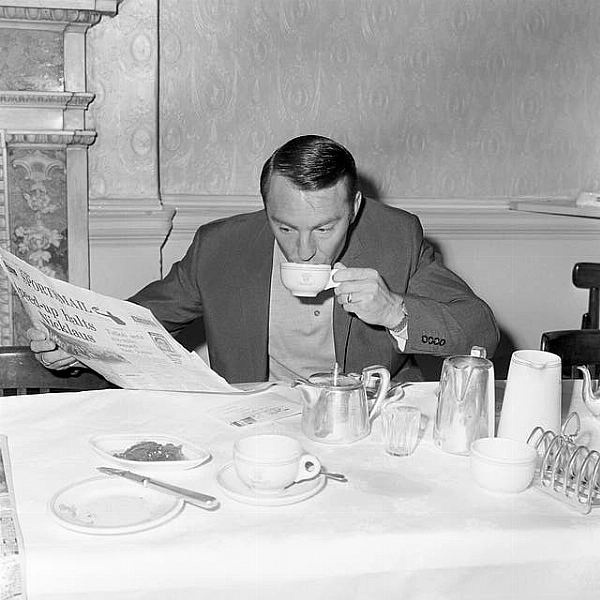 Jimmy Greaves reads a newspaper at the England team hotel during the 1966 World Cup