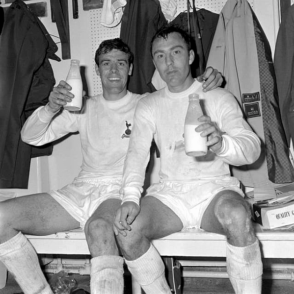 Jimmy Greaves, right, and Mike England celebrate winning the 1967 FA Cup with a pint of milk in the dressing room at Wembley