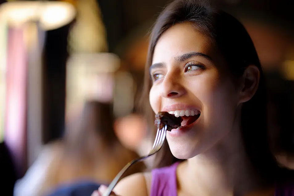 woman eating meat