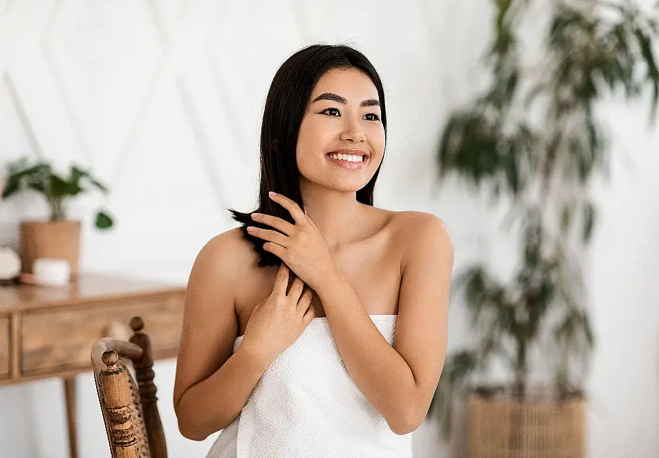 Woman applying a hair treatment