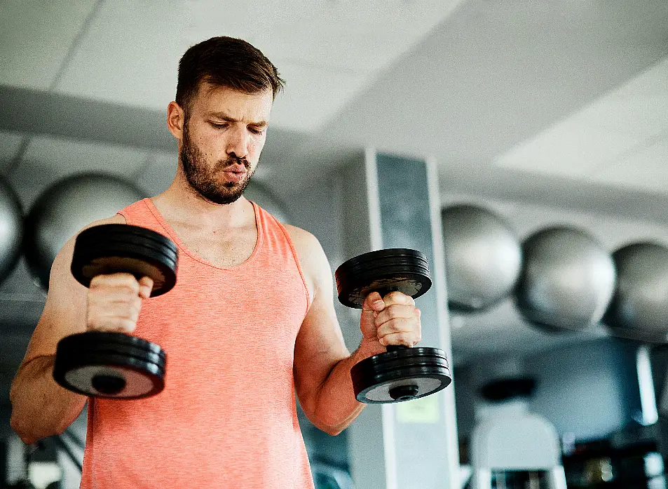 man lifting weights