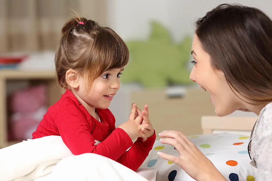 Caregiver and toddler playing