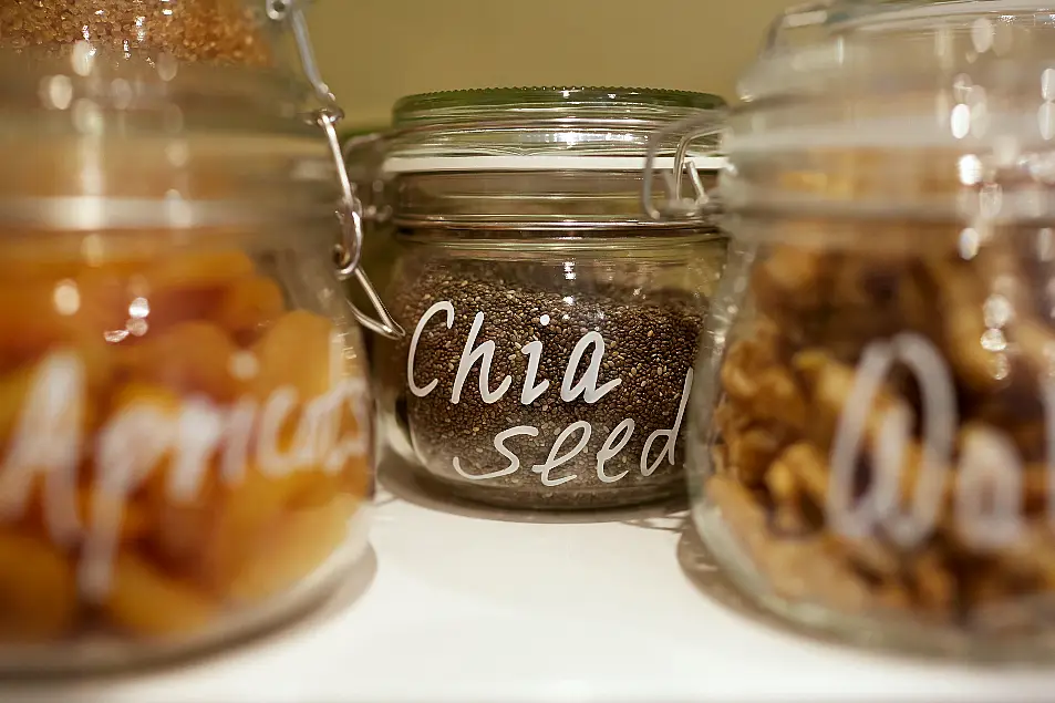 Glass storage jars with dried fruit and seeds