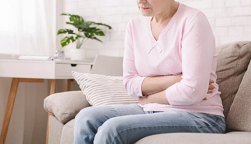 woman holding stomach