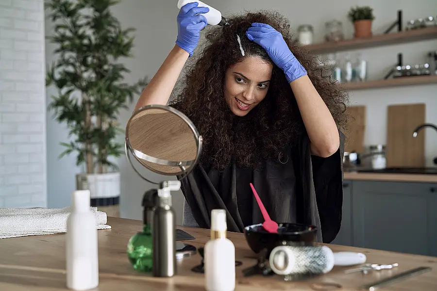 woman colouring her own hair