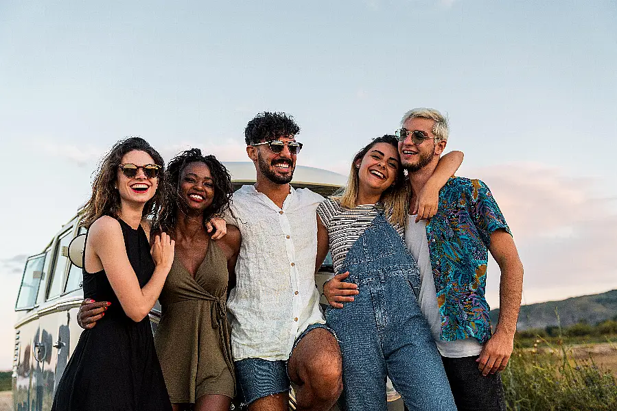 Group of friends hugging in nature