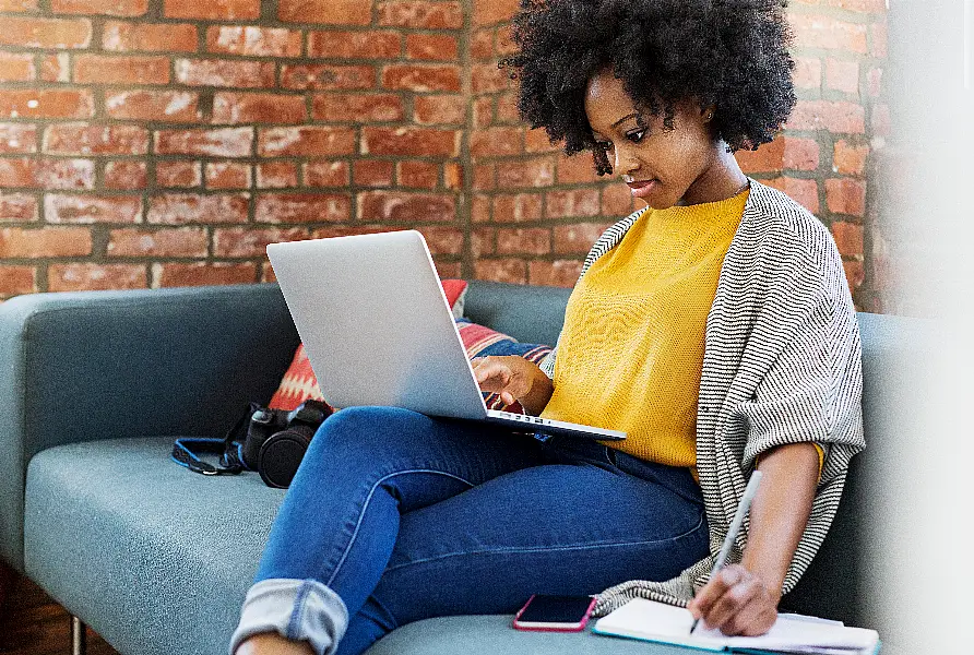 woman looking at laptop