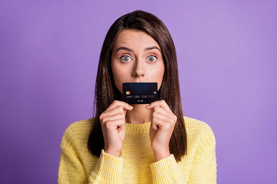 Woman holding bank card