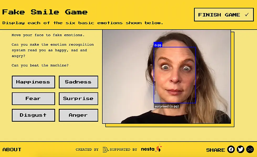 Dr Alexa Hagerty plays a game on the Emojify website, which demonstrates AI emotion recognition technology. (Cambridge University/ PA)