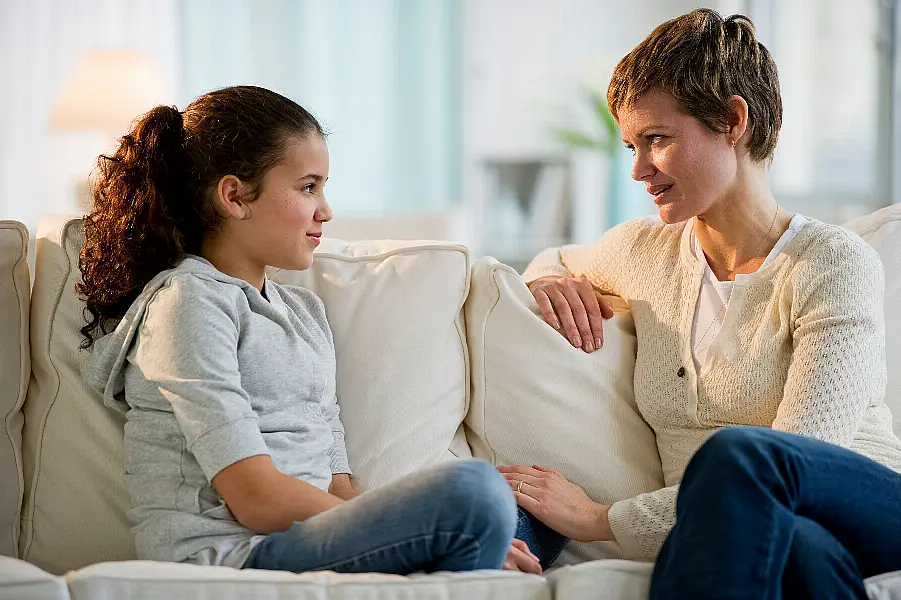 Mother and daughter having a serious conversation