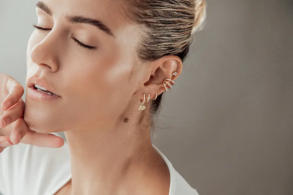 Helix & Conch Cascara Gold Huggie Hoop Earrings With Detachable Shell Charm, £40; Stretta Gold Ear Cuff, £21; Etoile Gold Star Tiny Single Huggie, £26; Bijou Tiny Gold Single Huggie Hoop Earring, £20; Quadri Gold Single Stud Earring, £16