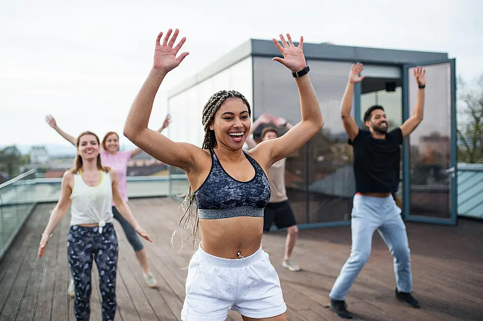 Group of people working out on a rooftop