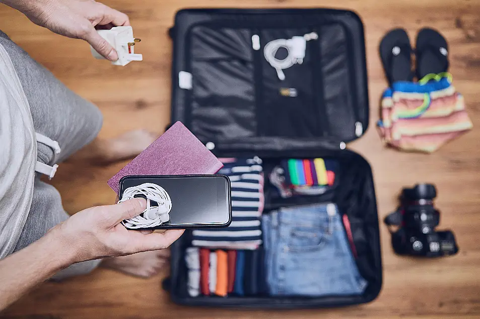 Man packing suitcase