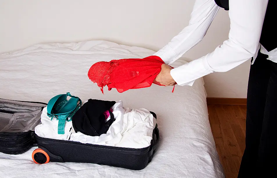 Woman packing a suitcase 