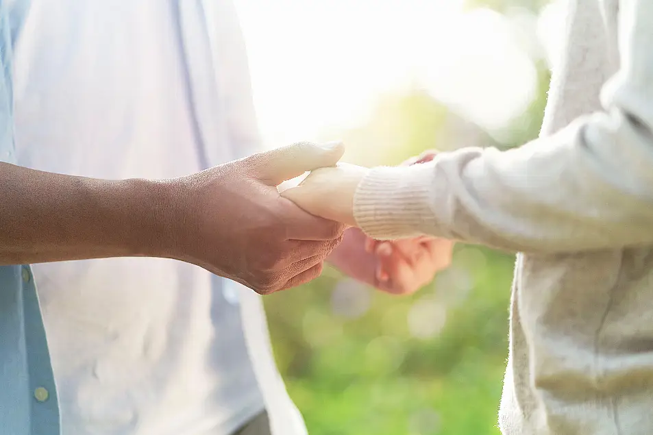 Couple holding hands