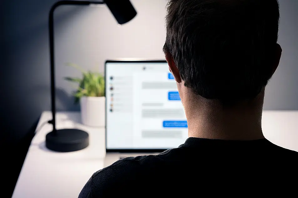 A man using an instant messaging service on a laptop (Alamy/PA)