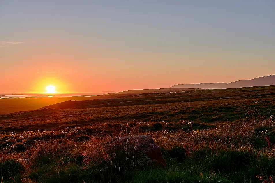 A midnight sunset in Skagafjordur, Iceland (Alamy/PA)