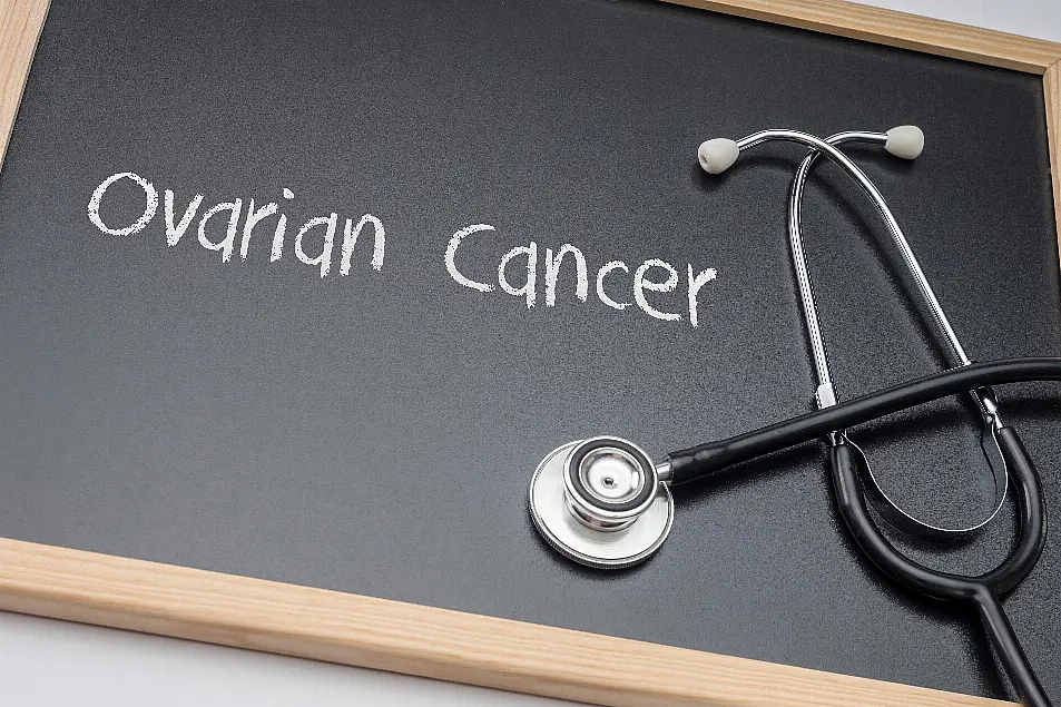 Ovarian cancer written in chalk on a blackboard next to a stethoscope