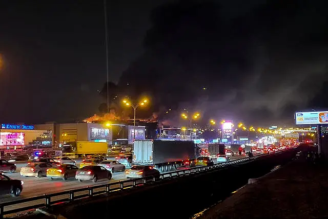 A massive blaze is seen over the Crocus City Hall on the western edge of Moscow, Russia 