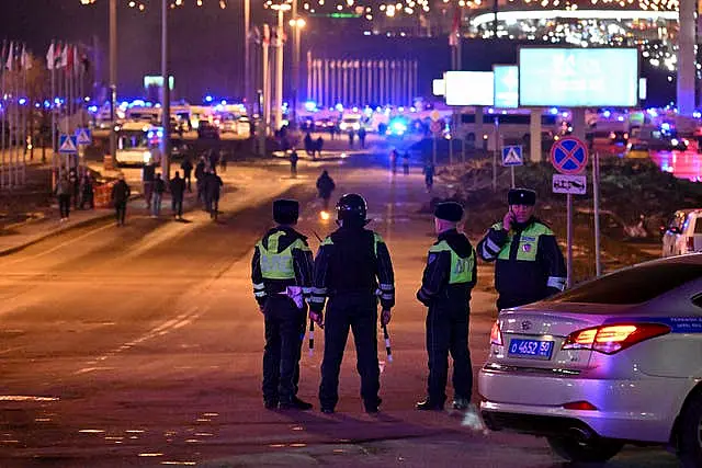 Police block the road to the Crocus City Hall on the western edge of Moscow, Russia