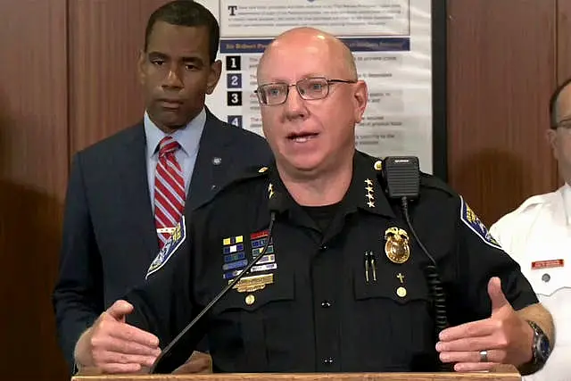 Rochester police chief David Smith, foreground, with Rochester mayor Malik Evans, as he addresses a news conference