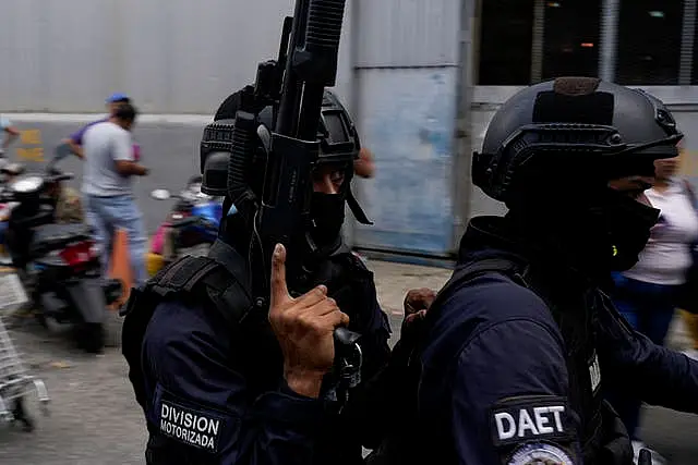 Police leaving the Boleita National Police detention centre where some people arrested during recent opposition protests against the official results of the election are held in Caracas, Venezuela