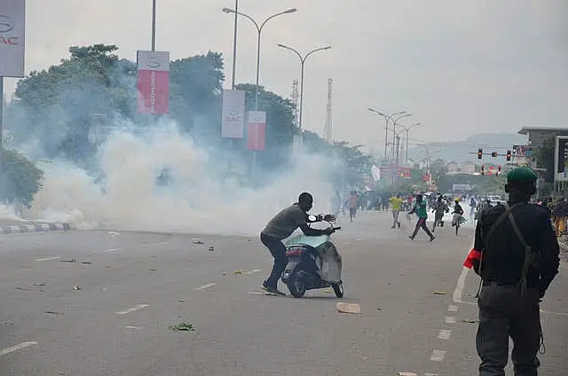 Tear gas fills a road