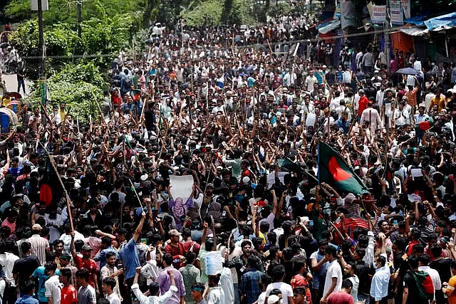 People participate in a rally against the Prime Minister