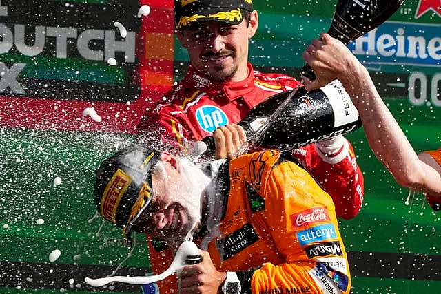 Norris is sprayed with champagne after his triumph