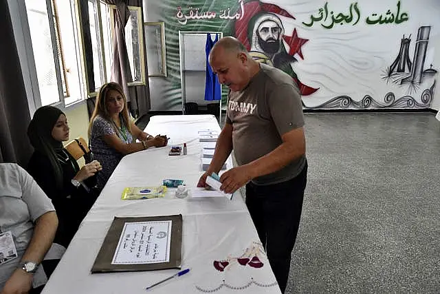 A voter casts a ballot