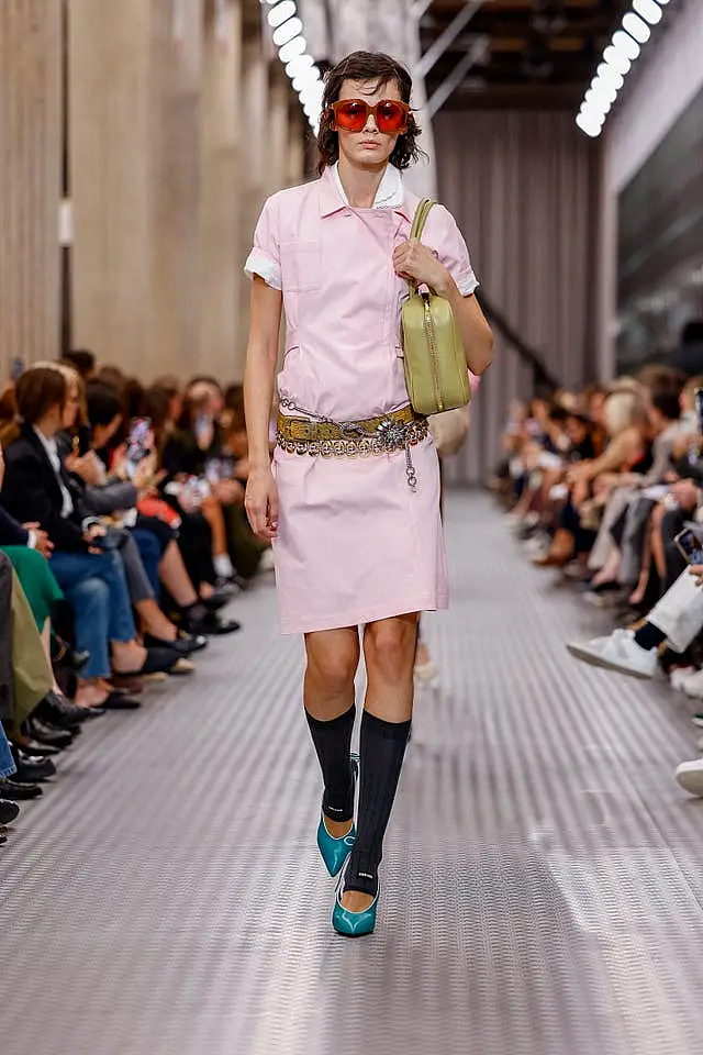 A model wears a creation as part of the Miu Miu Spring/Summer 2025 collection