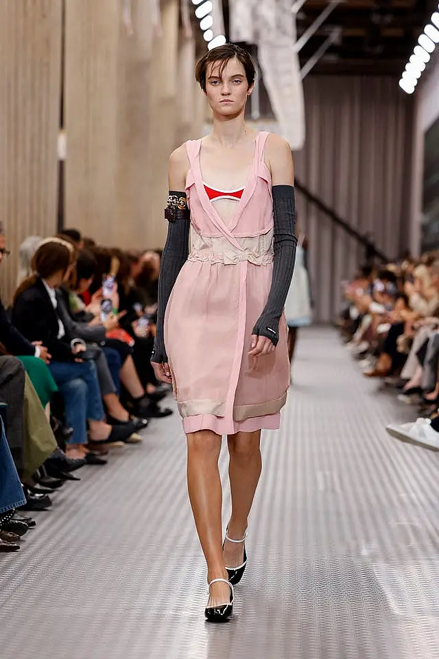 A model wears a creation as part of the Miu Miu Spring/Summer 2025 collection