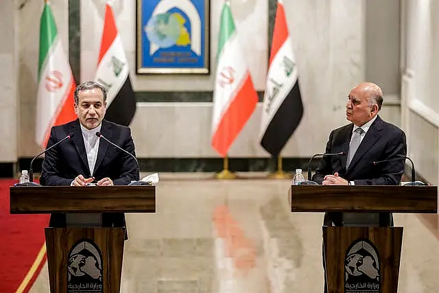 Iraqi foreign minister Fouad Hussein, right, and his visiting Iranian counterpart Abbas Araghchi at a news conference in Baghdad 