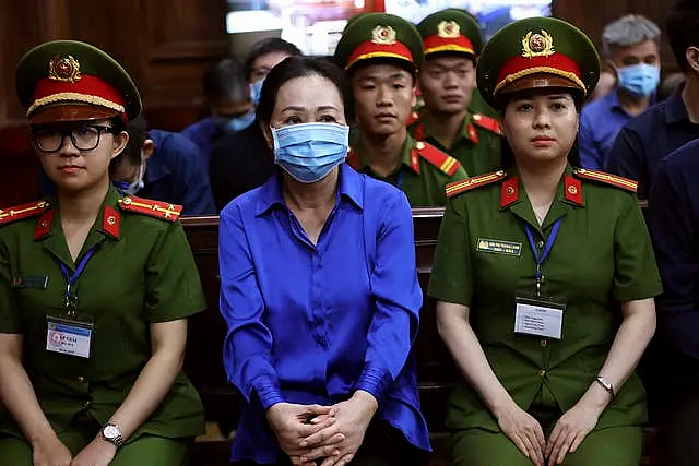 Truong My Lan, centre, sits in court 